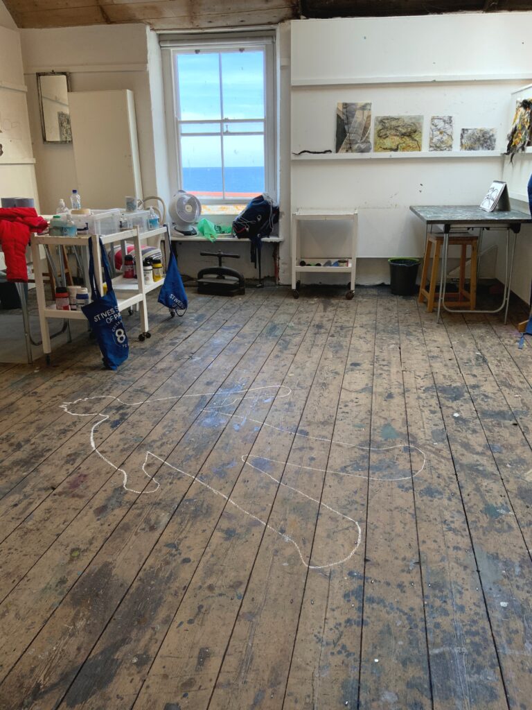 picture of The St Ives School of Painting studio with a chalk man on the wooden floorboards