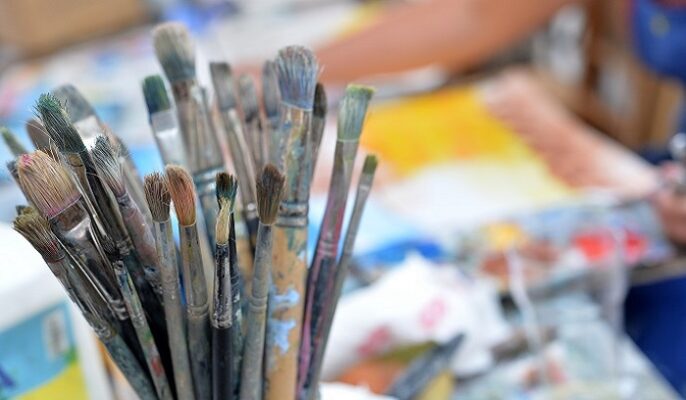 photograph of artist brushes in a studio at the st ives school of painting