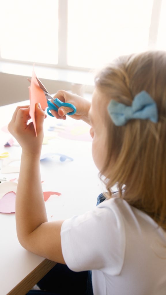 Sunday Kids Club Child cutting paper