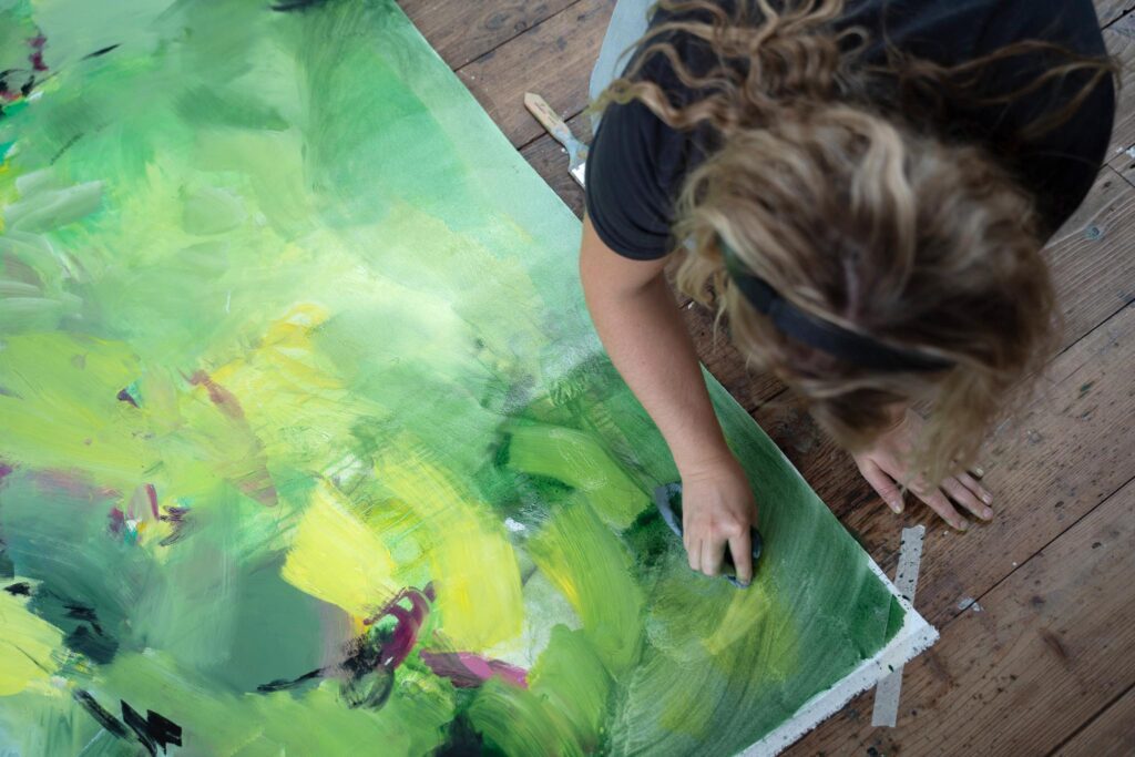 Artist Caroline Robinson working on a large scale painting in the Roy Ray Studio at The St Ives School of Painting
