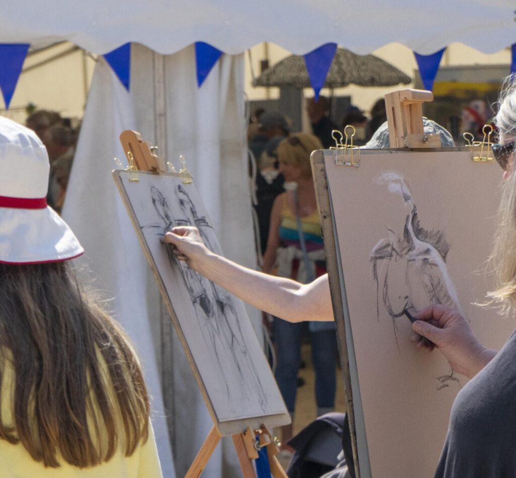 St Ives School of Painting at the St Ives Food and Drink Festival on Porthminster Beach, pictured with a life model
