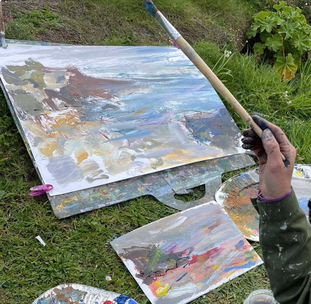 Amy Albright painting in the elements