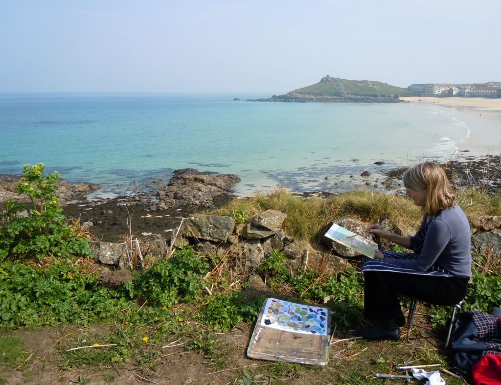 A student learning how to paint a landscape painting at St Ives School of Painting