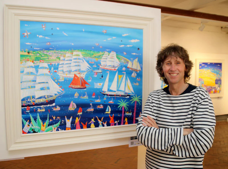 John Dyer standing beside his Tall Ships Painting, Falmouth