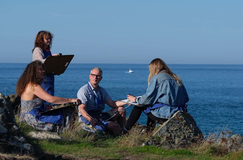 students drawing St Ives landscape using boards en plein air