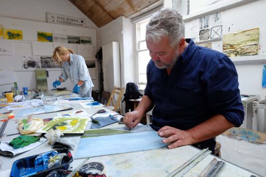 student working in school of painting studio on experimentation art course